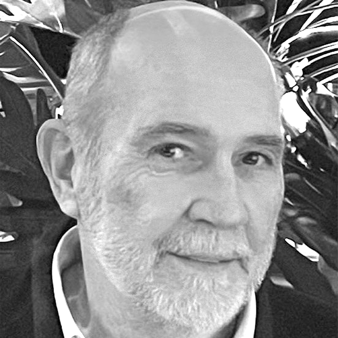 Black and white headshot of Woody Rainey