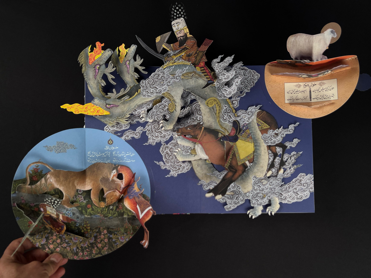 An overhead view of a popup book featuring various mythical creatures.