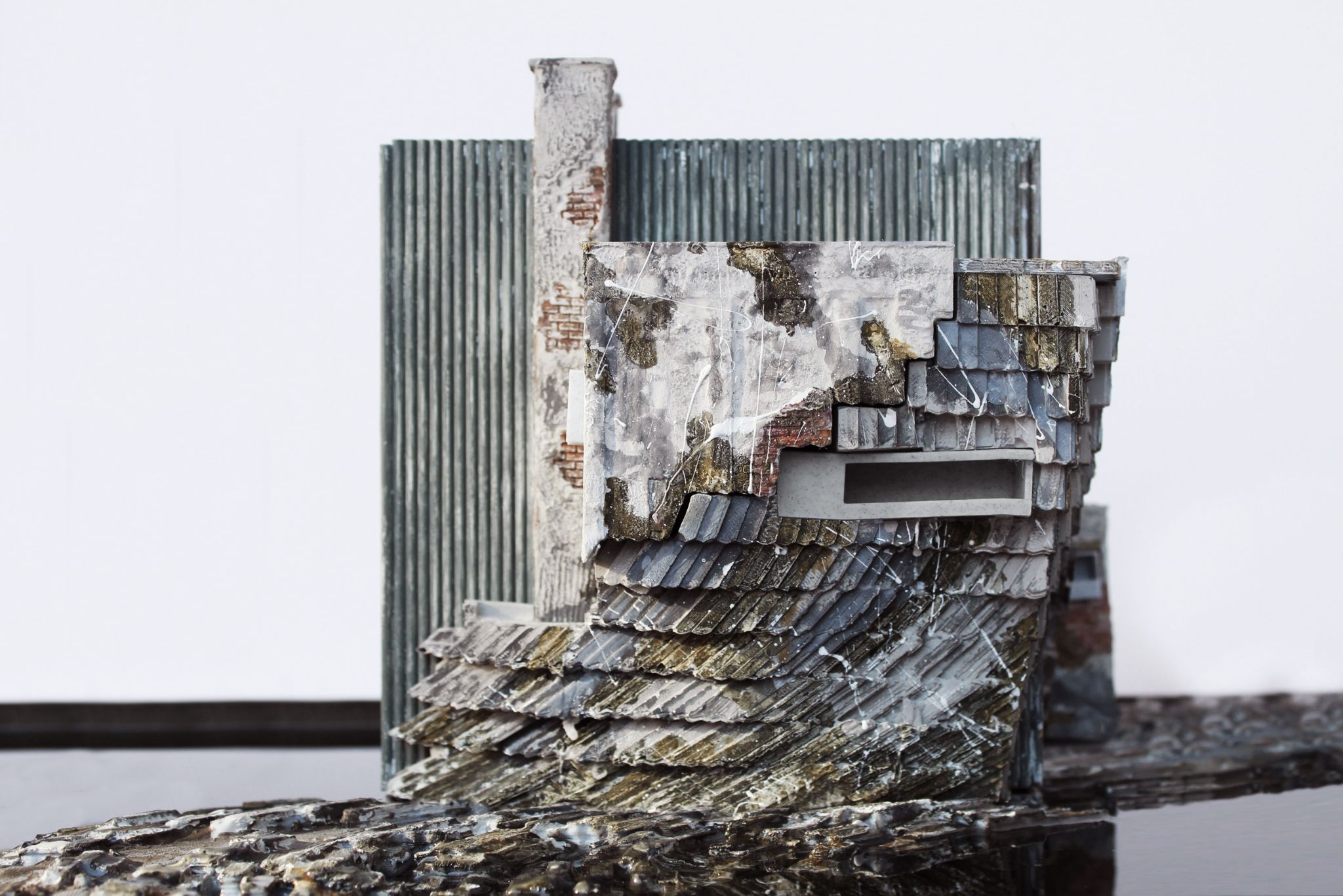 A hyper-realistic rendering of a shingled slope set in front of a corrugated steel wall. A chimney rises against the steel wall.