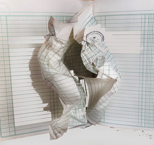 Abstract paper sculpture that looks like an oversized crumpled sheet of line paper.