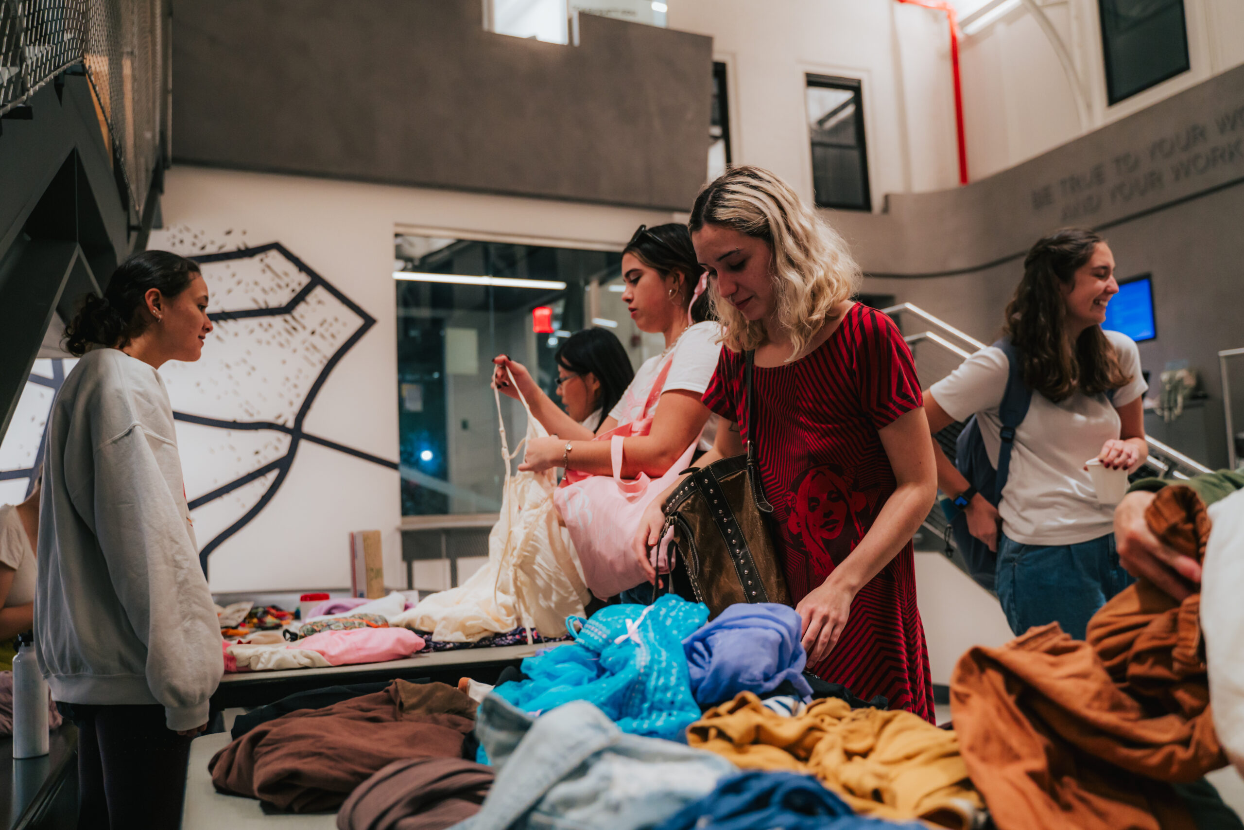 Students in the Student Union for the Clothing Swap and Repair hosted by Envirolutions for Pratt Earth Action Week.
