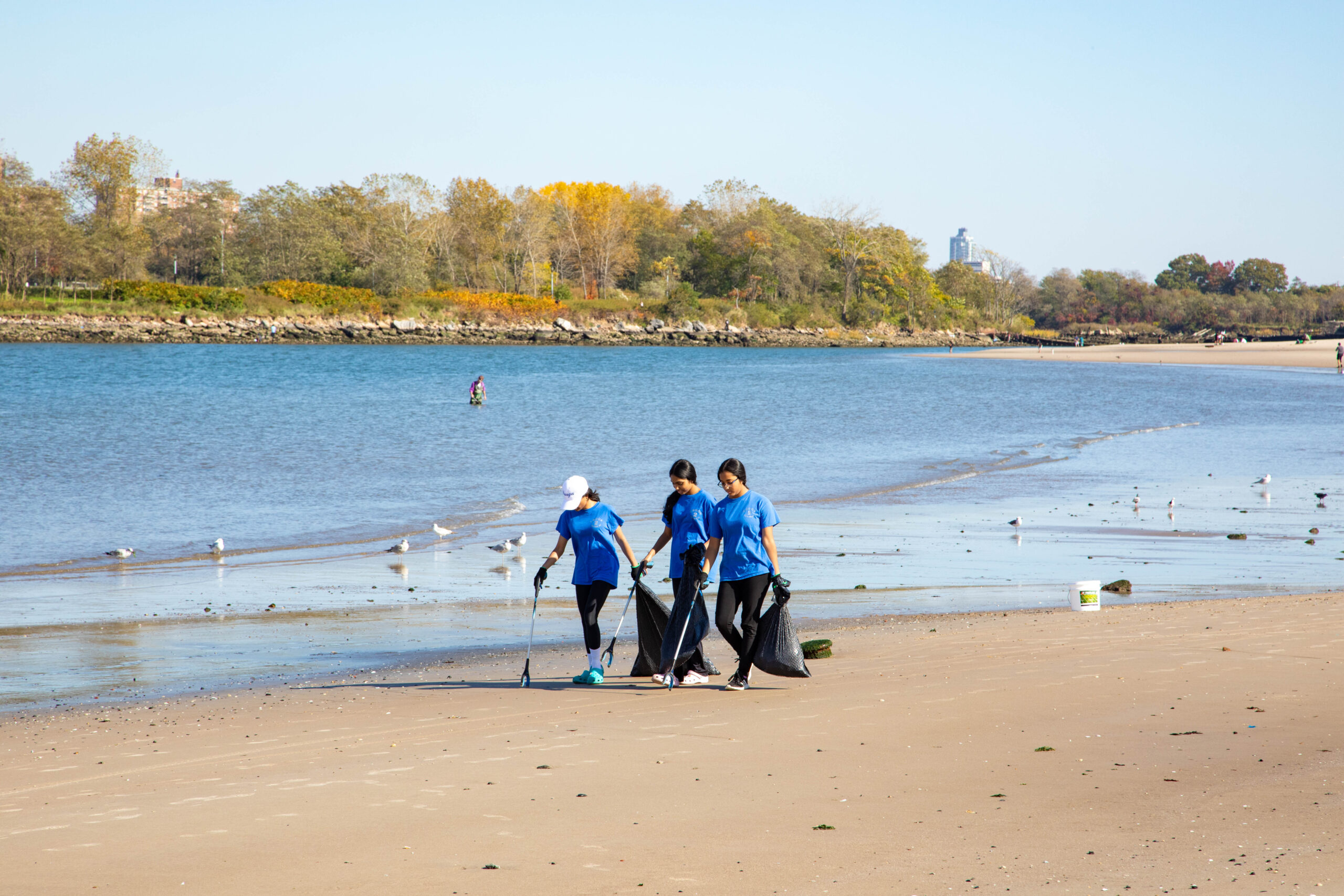 Students participating in a beach clean-up of Coney Island's Creek Park for Pratt Earth Action Week.