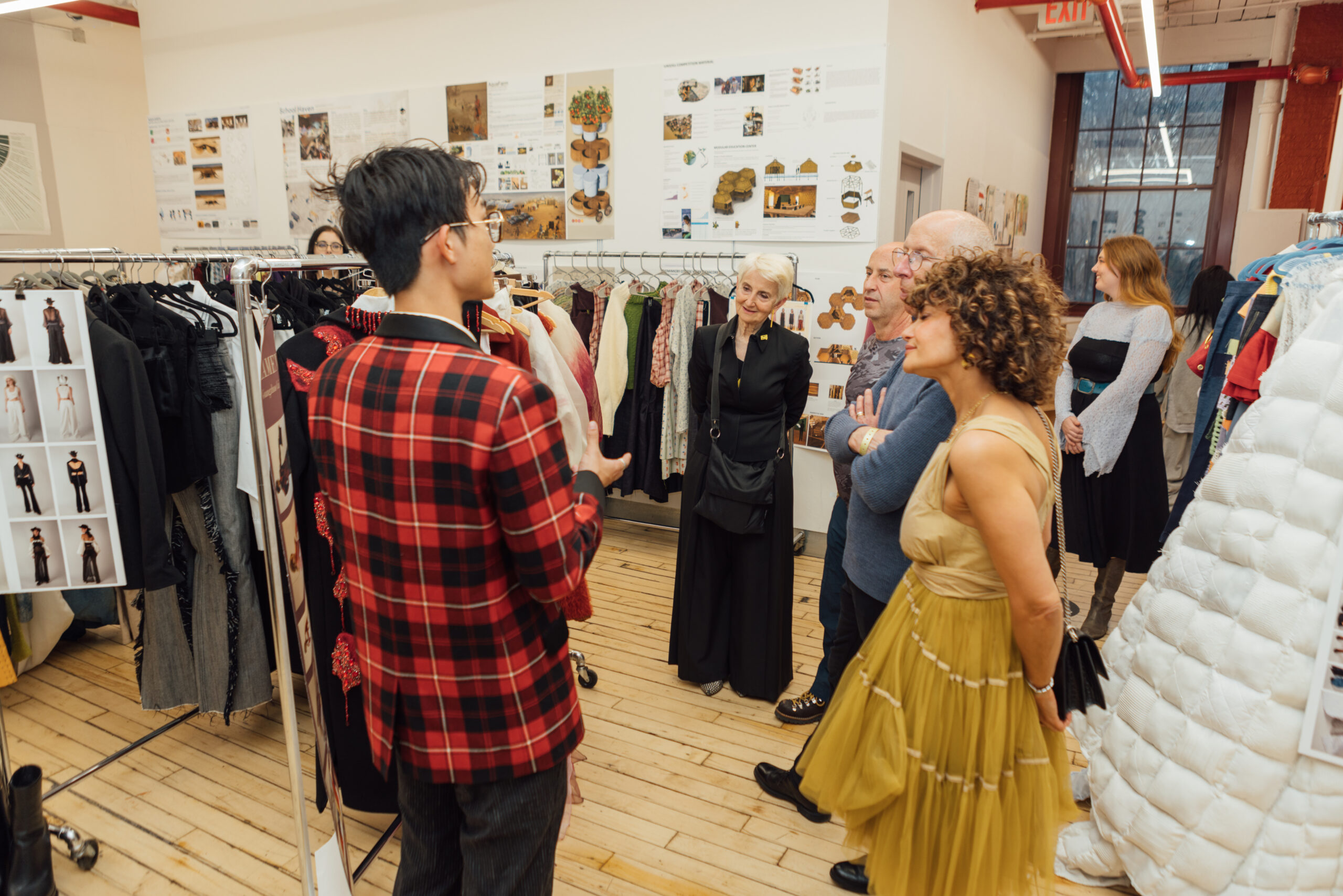 students having a conversation, in large gallery room