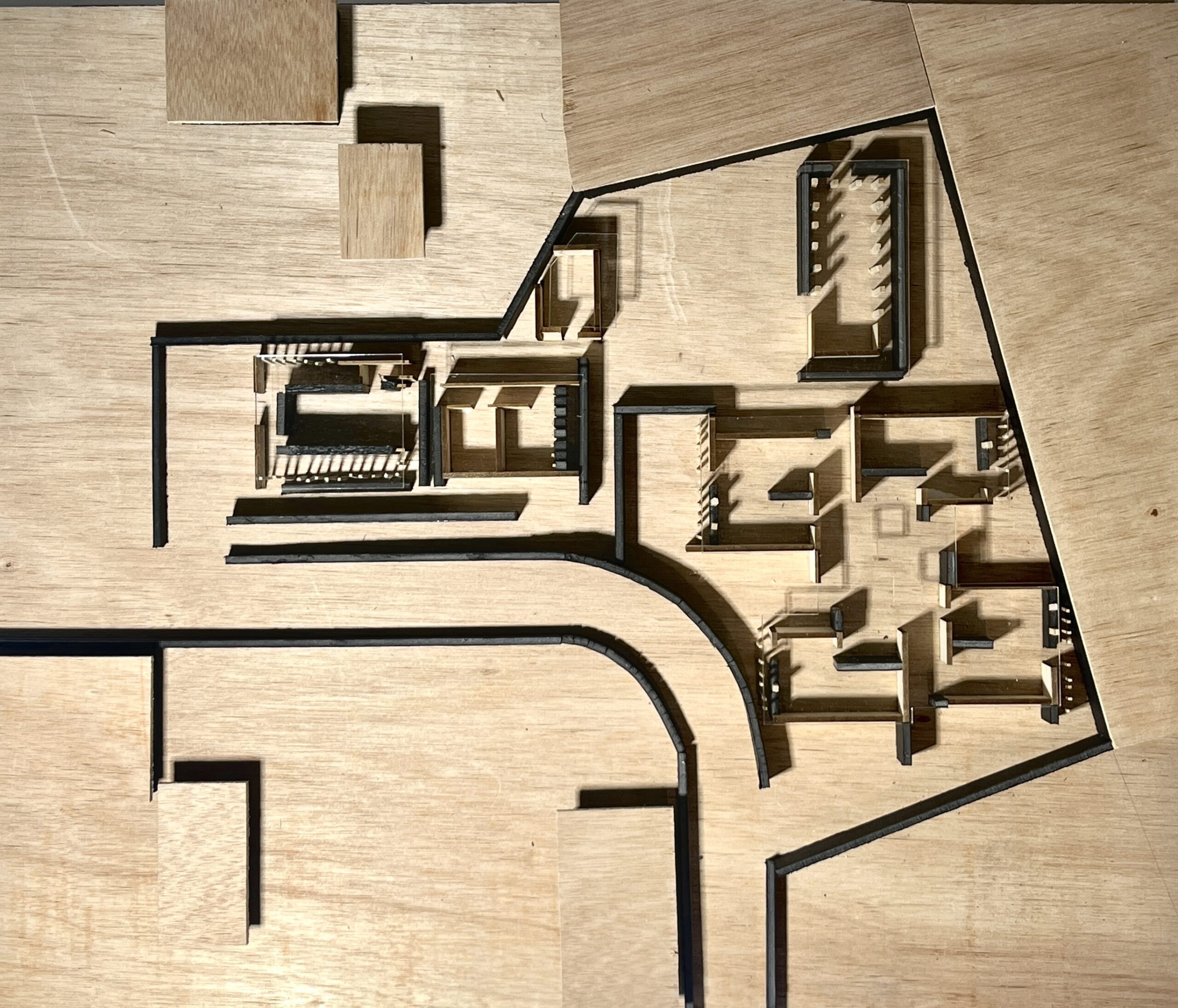 An overhead photography of a three-dimensional model showing the floorplan of a structure