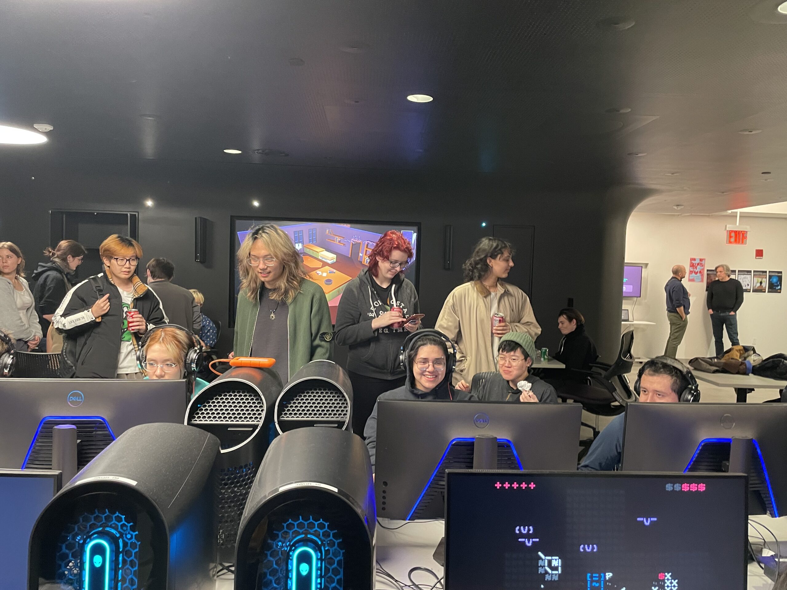 Image of Alumni and students testing video games