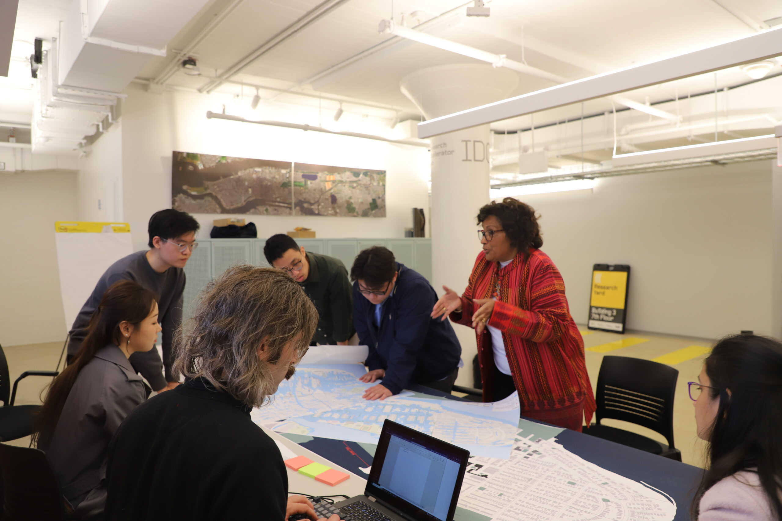 Pamela Pettyjohn (Co-Founder and President of the Coney Island Beautification Project) working with students sketching, comparing, and visualizing (using AI) strategies for retaining water from Coney Island Creek at “Condensations Designing in Water 03; Design and Action,