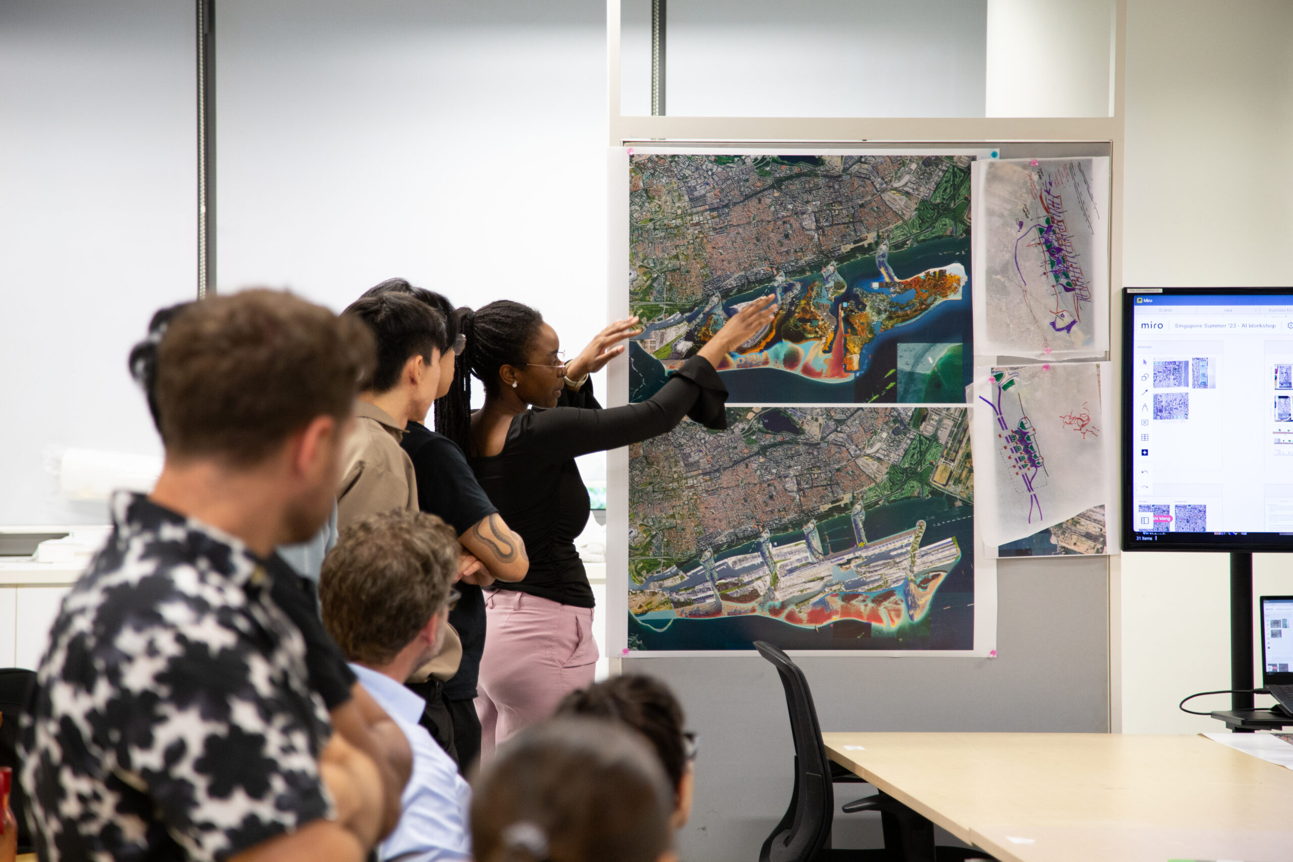 SUTD students presenting a coastal defense and resource enrichment strategy during a design workshop.