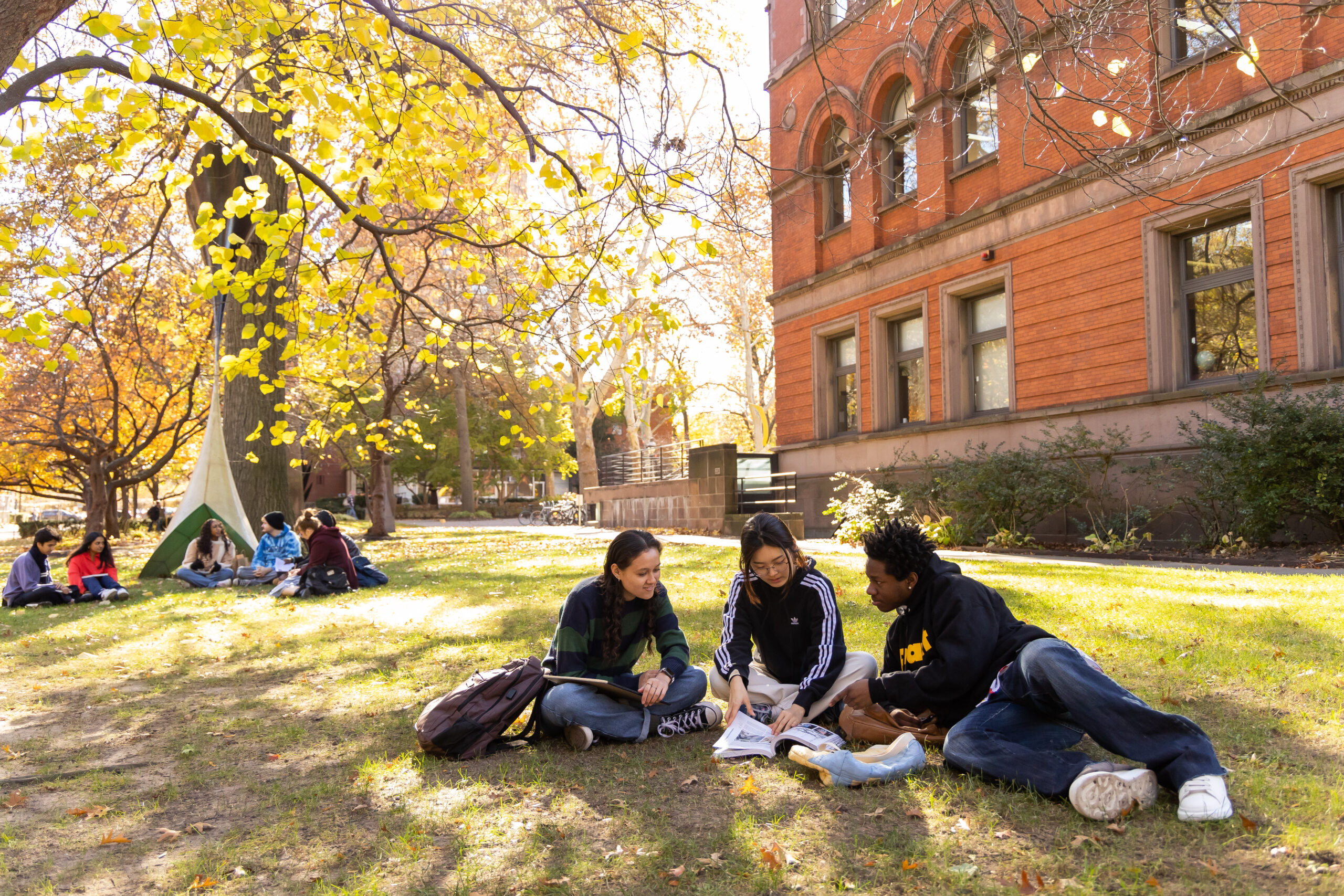 Pratt Institute students sitting together, on campus