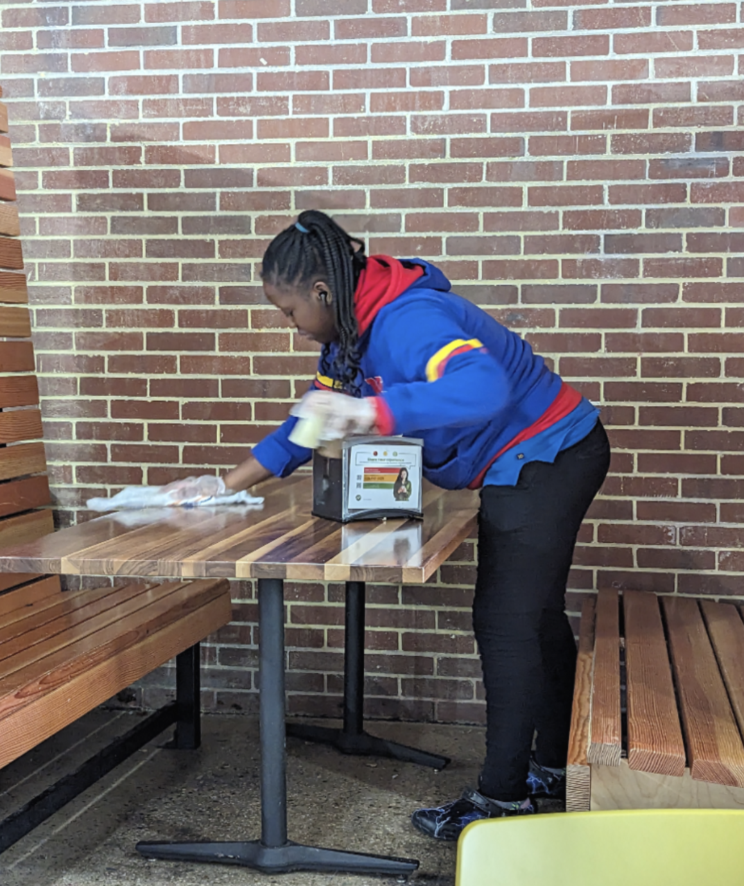 Project SEARCH intern cleaning tables in the cafeteria