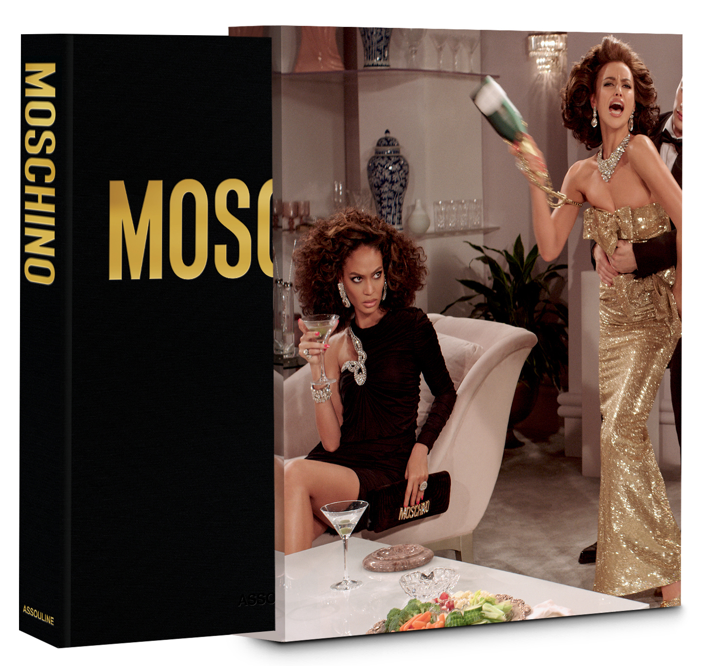 Book pulled slightly from slipcover featuring a photo of fashion models in gowns and a tuxedo staging a fight with a champagne bottle