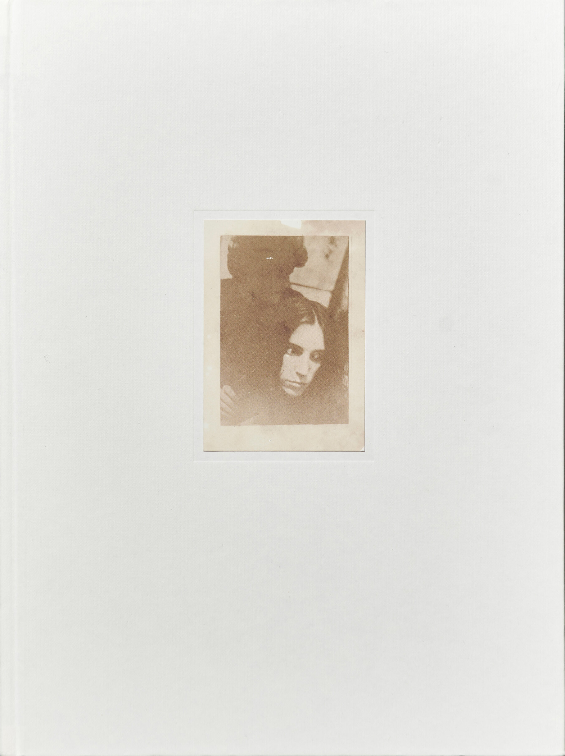Book cover for Lloyd Ziff's photobook DESIRE, featuring a black-and-white photo of Patti Smith and Robert Mapplethorpe centered within a thick white border