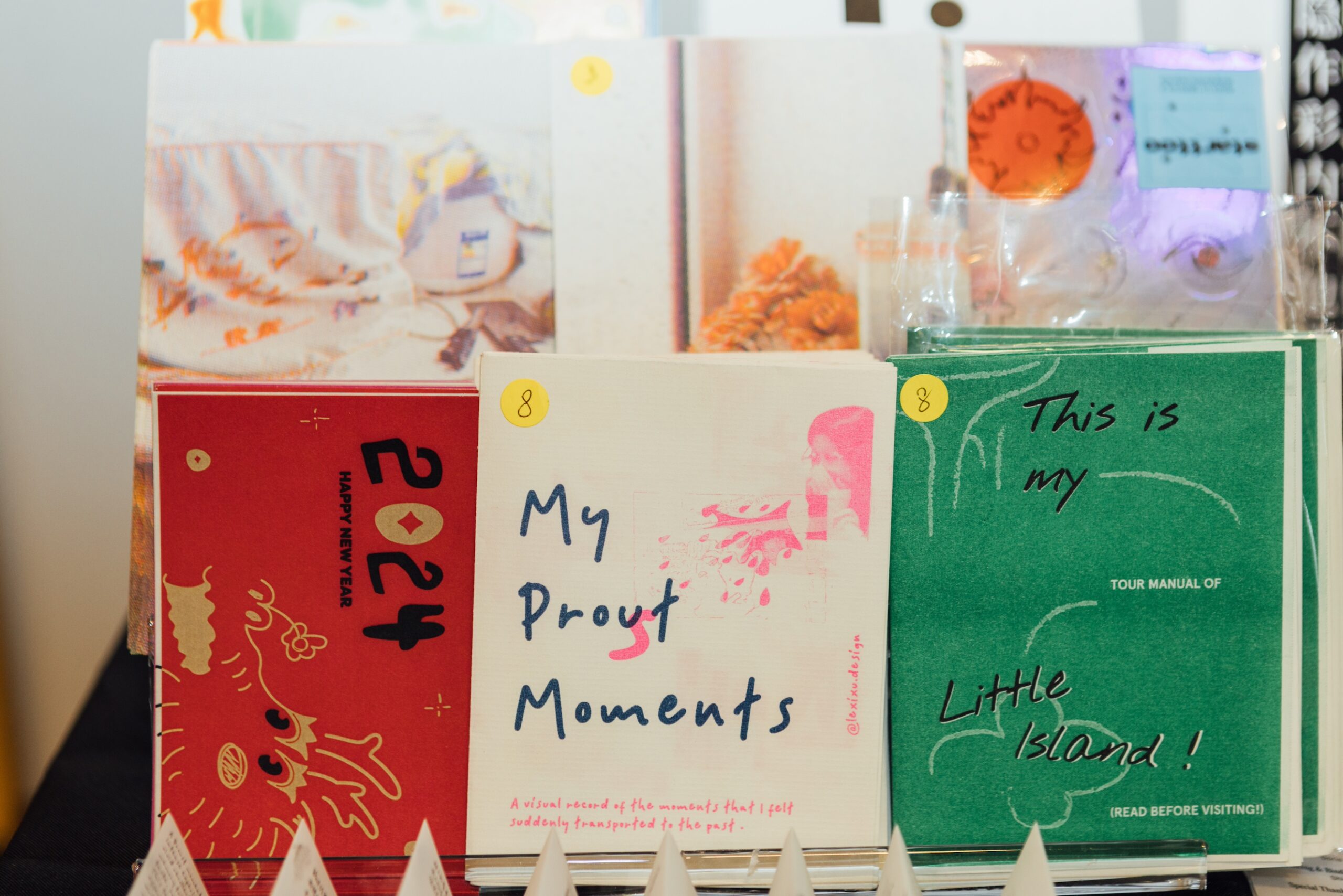 A selection of books on display, with titles including My Proust Moments and This Is My Little Island