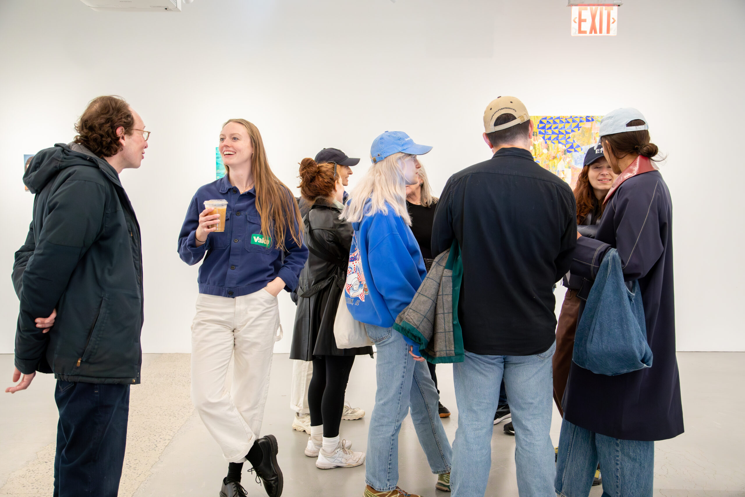 A group of guests mingling at the Open Studios