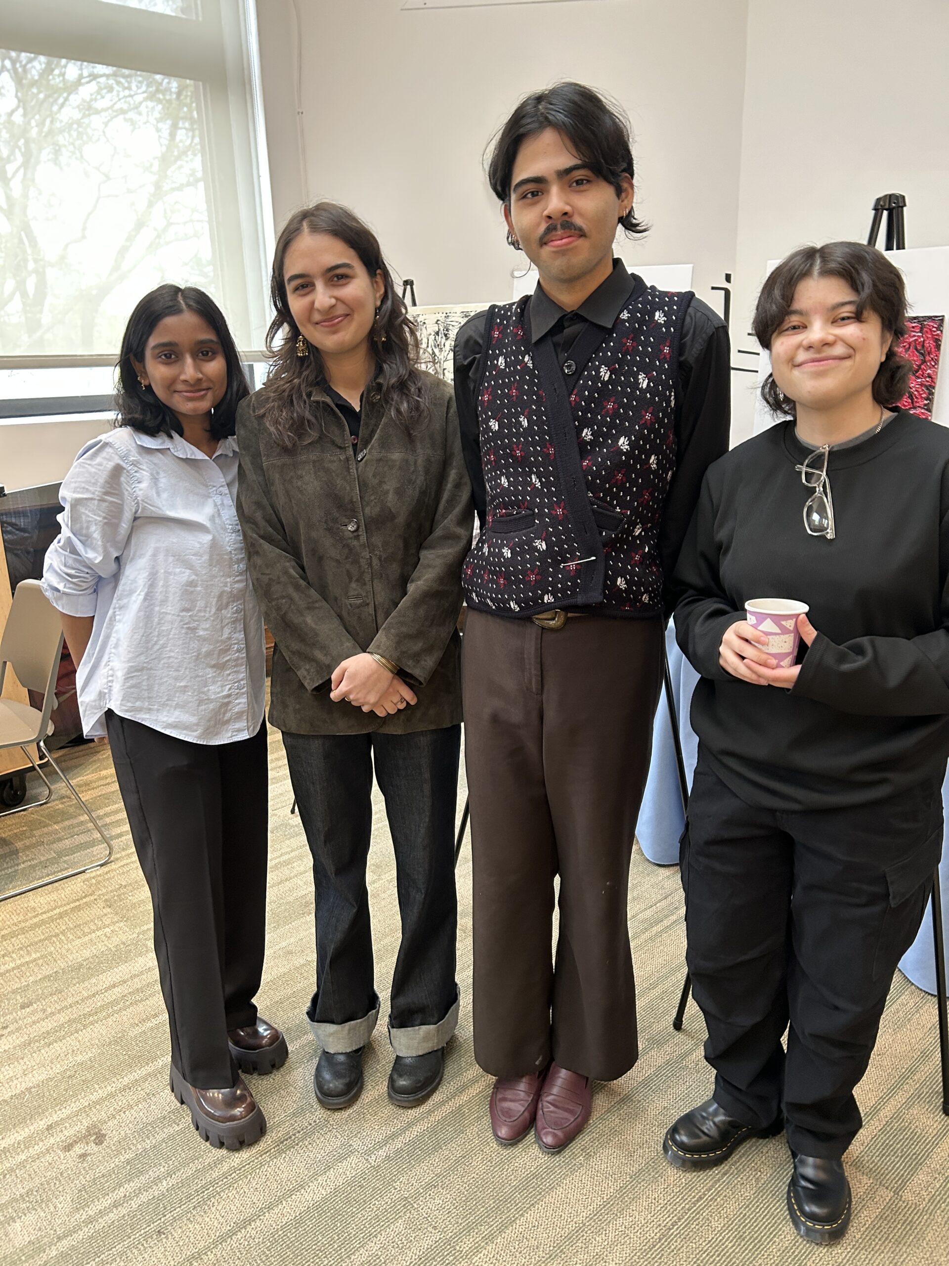 Four finalists for the Charles Pratt Memorial Scholarship pose together.