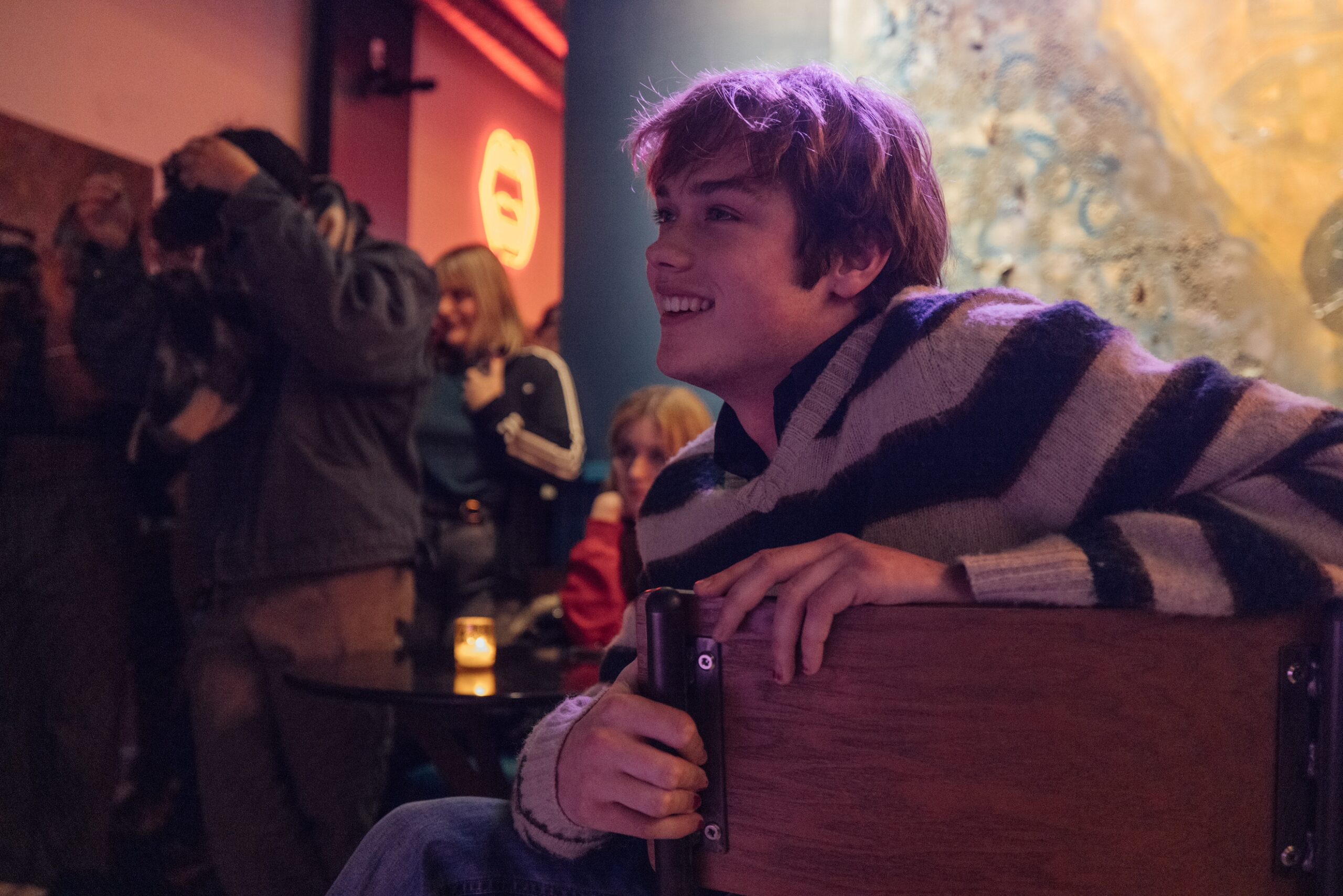 An audience member smiles at the performance