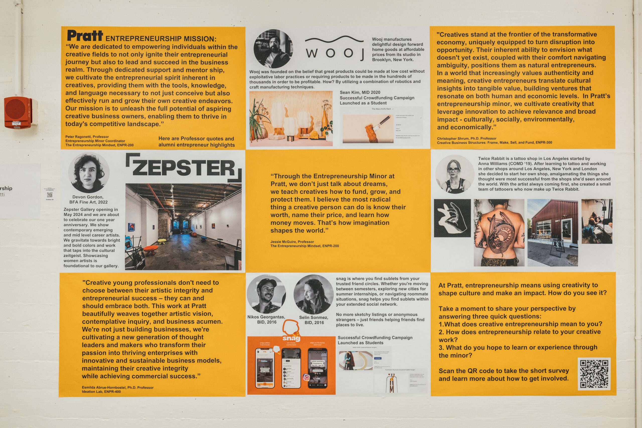 Photo of a wall-mounted display showcasing the Pratt Institute’s Entrepreneurship program. The layout features a series of yellow, orange, and white blocks of text and images, highlighting quotes from professors and successful alumni. Topics include the value of entrepreneurship in creative fields, student startup examples like “Wooj,” “Zepster,” and “Snag,” and testimonials from faculty such as Peter Ragonetti, Jessie McGuire, and Emeline Abreu-Hornedo. The lower right corner features a call-to-action asking viewers how entrepreneurship relates to their creative work, alongside a QR code for further engagement.
