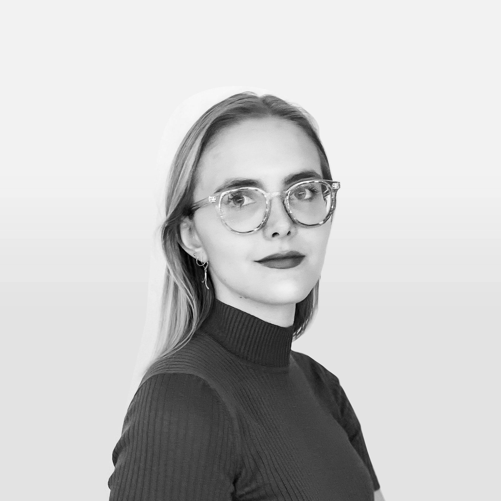 Black-and-white headshot of Grace Hopkins, wearing glasses and a dark turtleneck