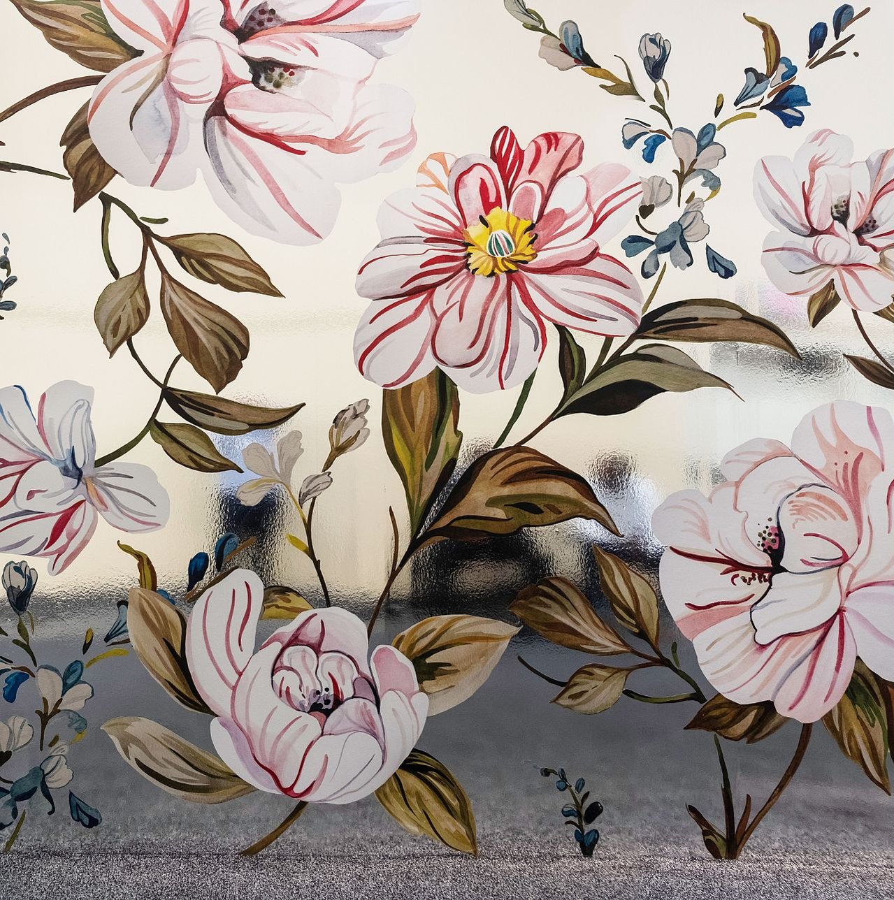 Reflective, chrome wallpaper adorned with pink-streaked white blossoms