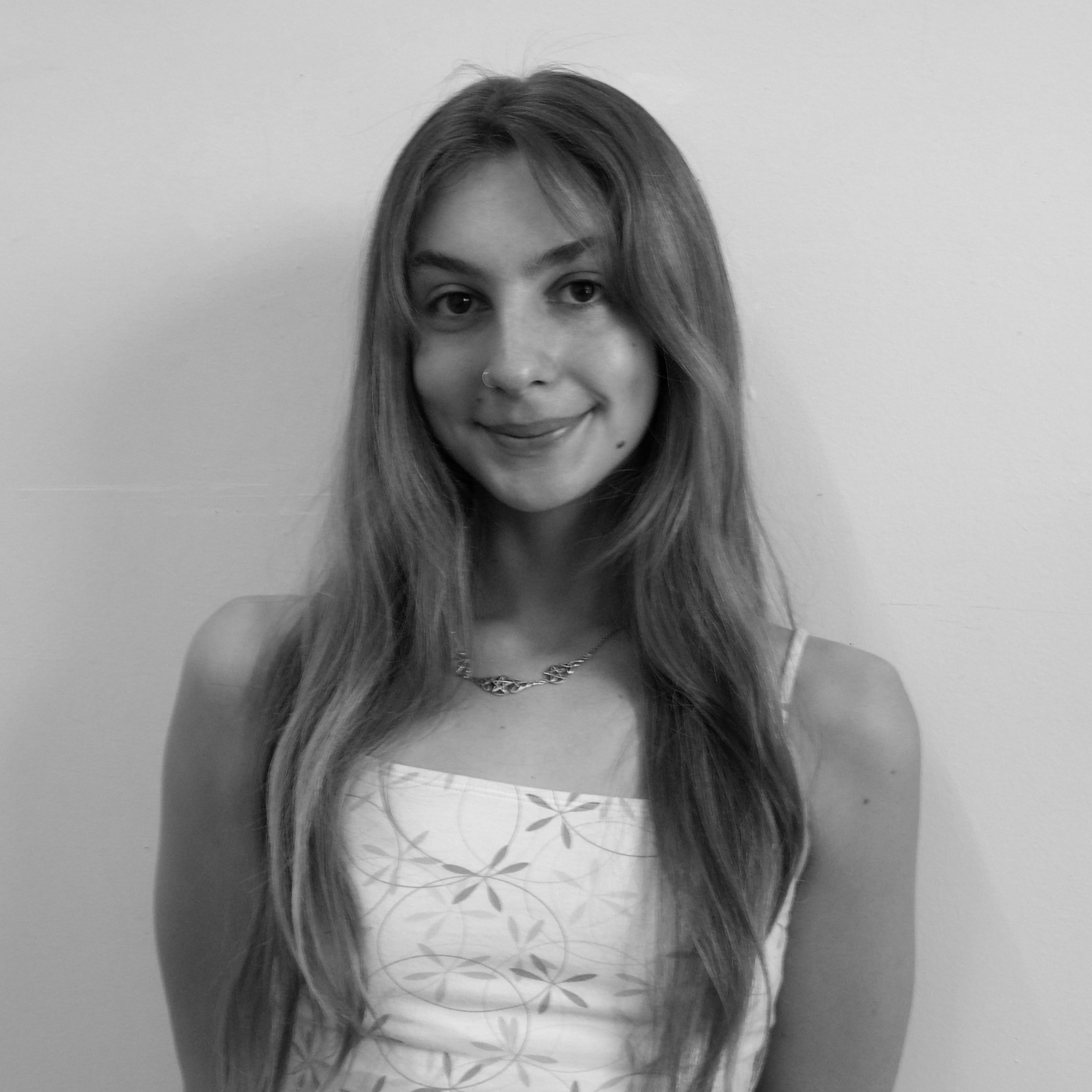 Black and white photo of Tempe Munach smiling.