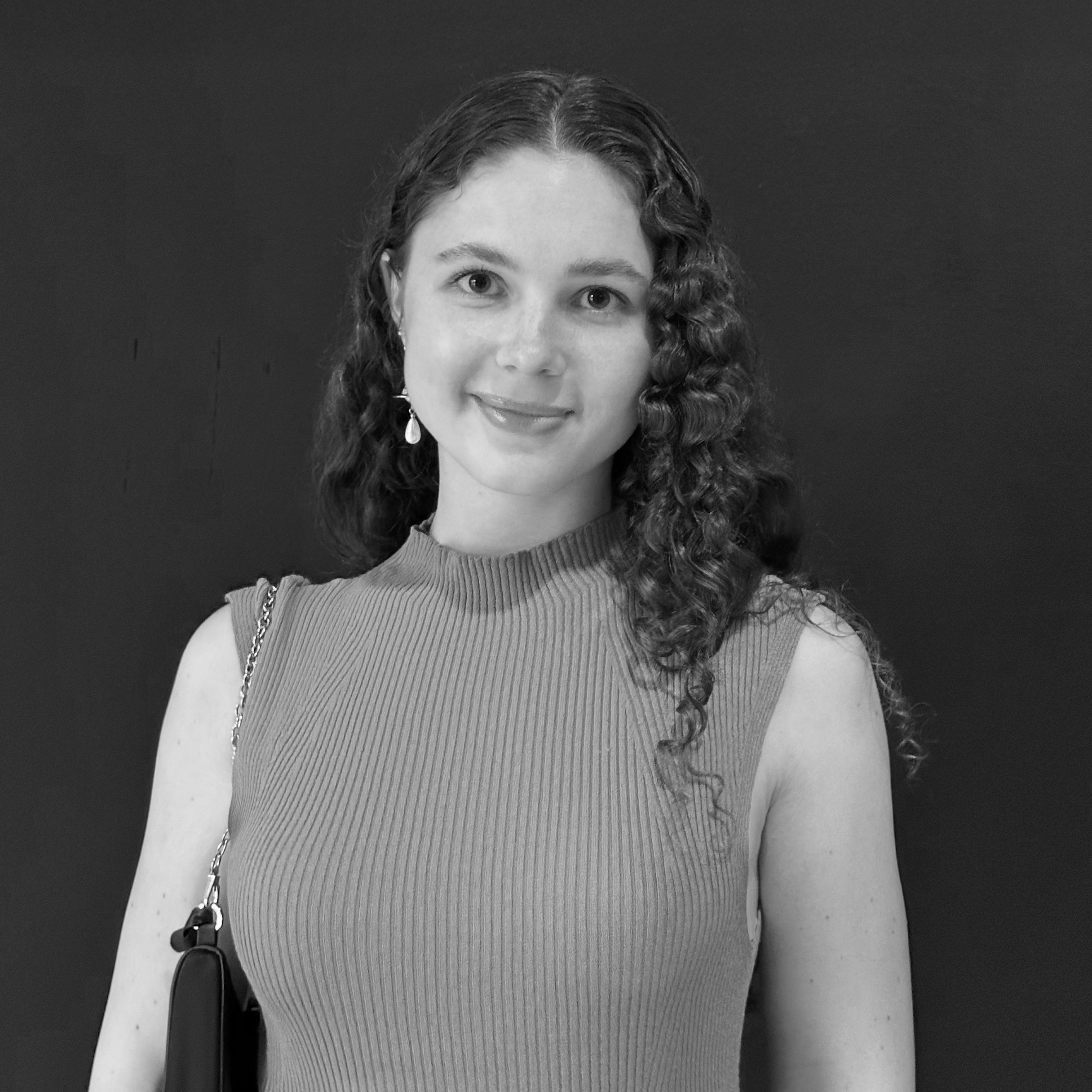 Black and white photo of Valeria Zhikharevich smiling.