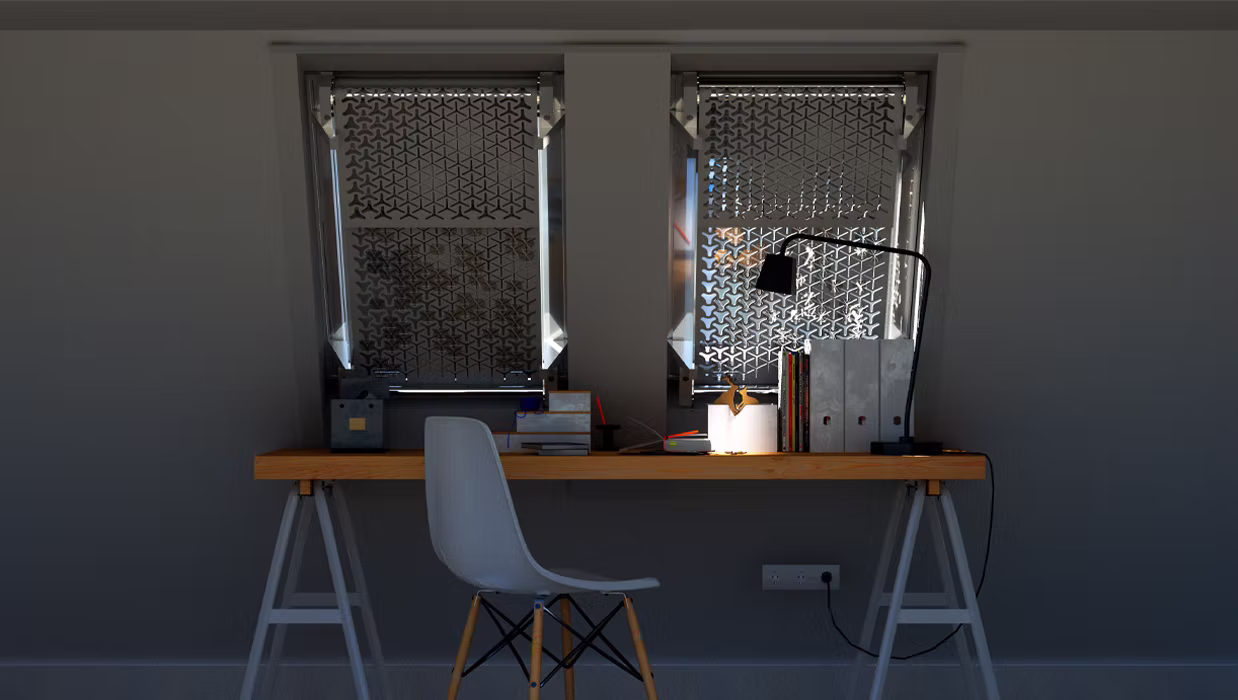 A mesh filter covers a window, blocking the light. A desk with a chair stands in front of the window.