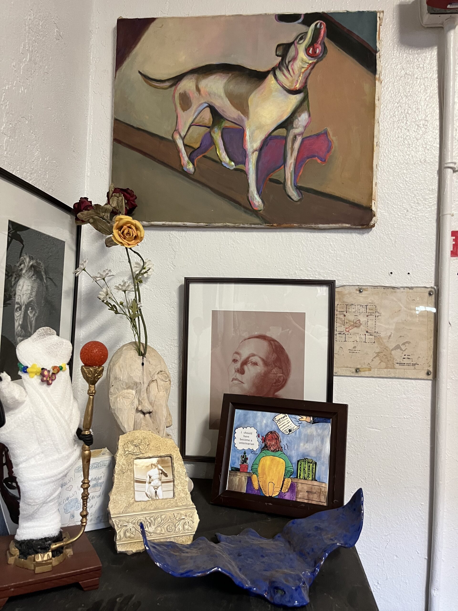 2D and 3D artworks arranged in a corner.