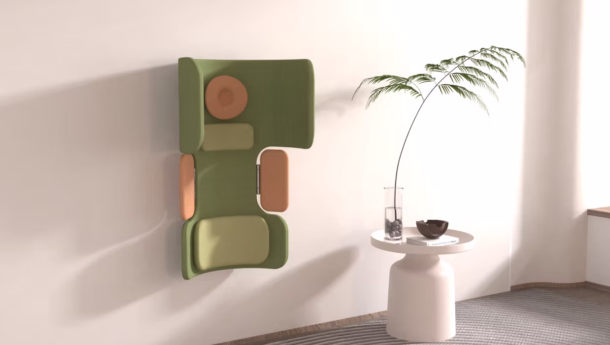 A light green, curved fixture with pads that's attached to a white wall.