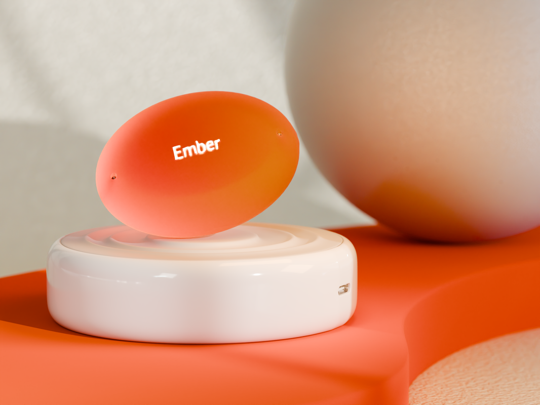 An orange oval with "ember" written on it rests atop a white platform.