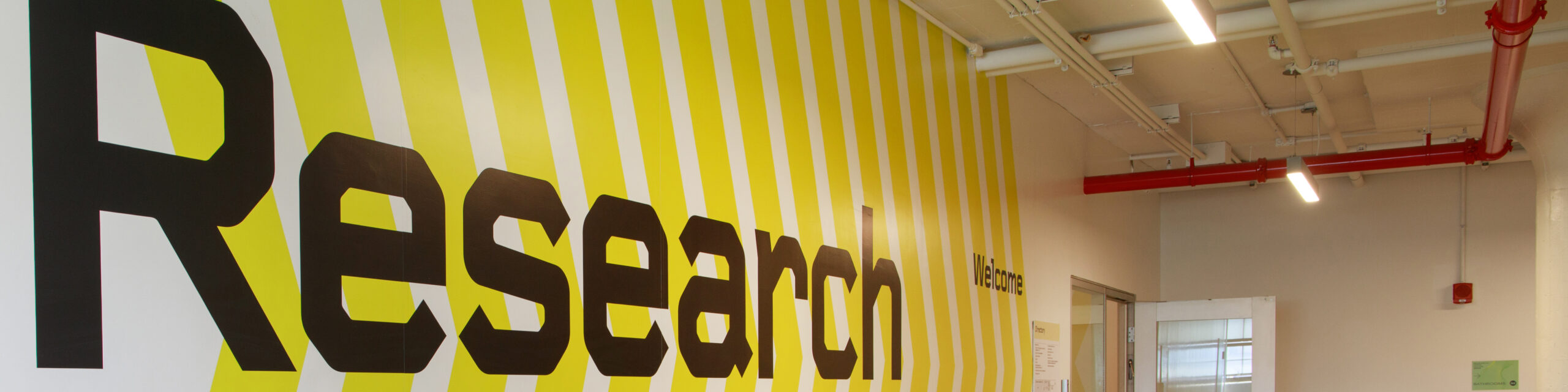 Image of a wall in a hallway with the text