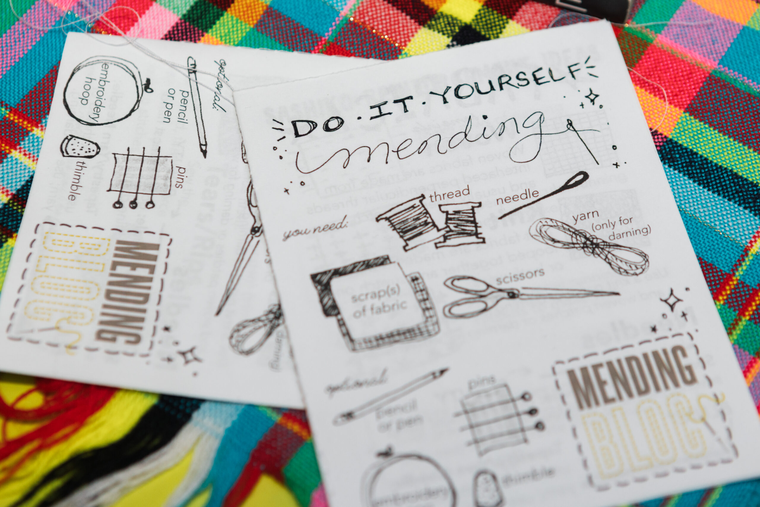 Close-up of a DIY mending guide featuring hand-drawn illustrations and text. The top section reads 