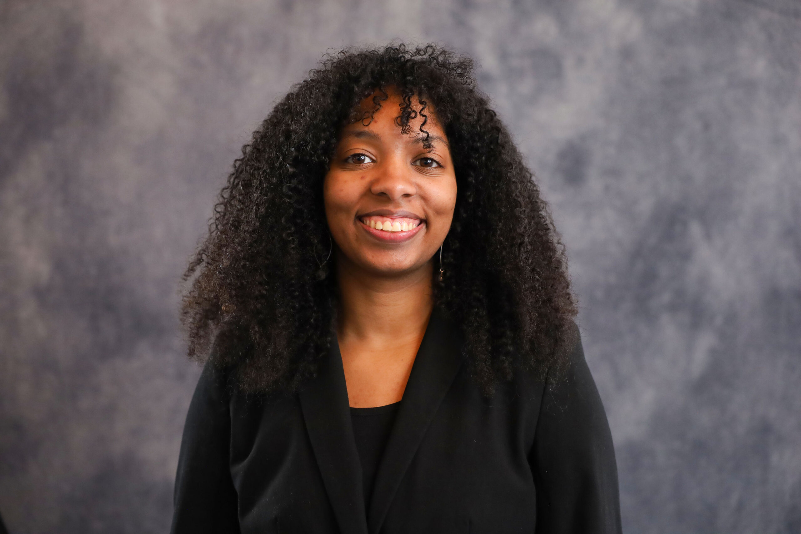 Alumna Catherine Chattergoon smiles in her headshot