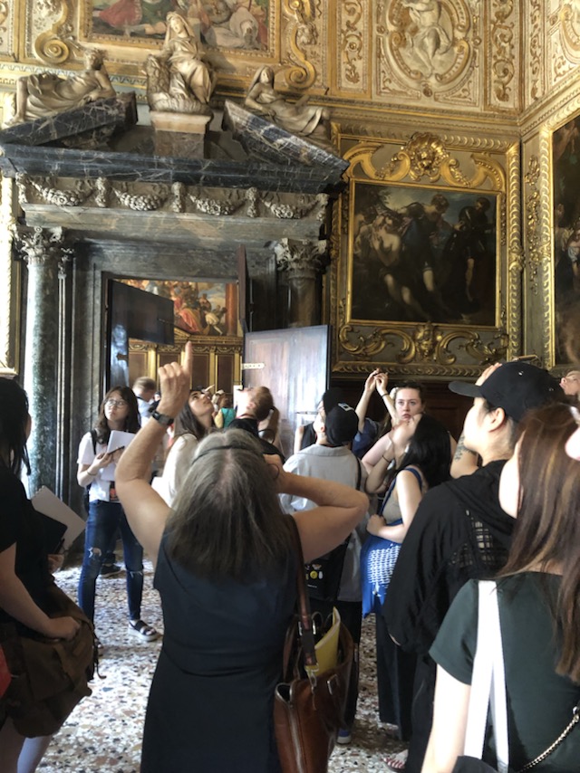 Student studying ceiling paintings in the Doges Palace