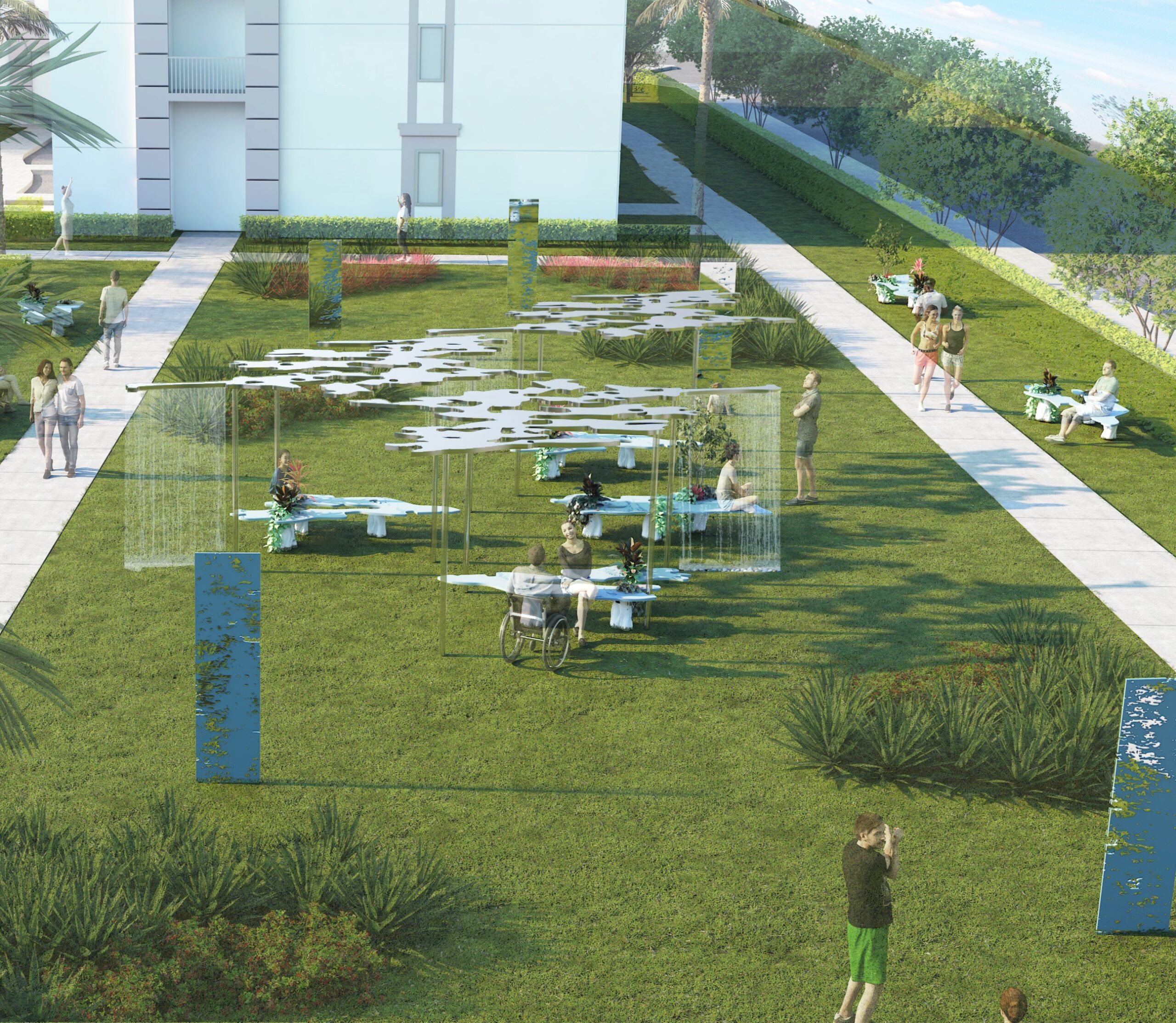 A digital rendering of a landscaped outdoor area features various groups of people engaging with the environment. Some individuals are sitting at tables with plants, while others walk along paved paths. A person in a wheelchair is present, and several decorative blue structures are scattered throughout the grassy space. Trees and shrubs border the area, creating a serene atmosphere.