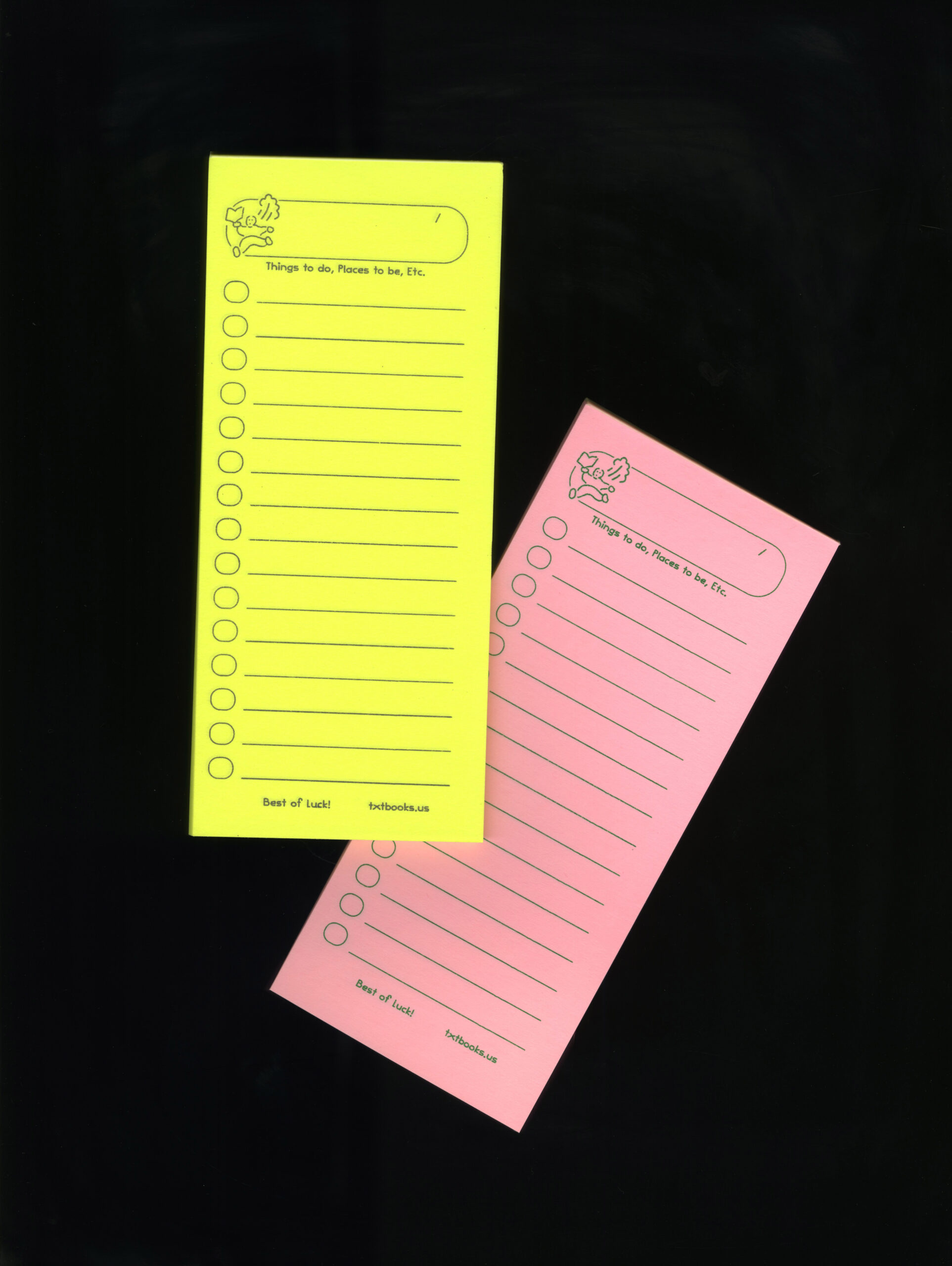 A bright yellow and a pale pink notepad. The top of the notepad is decorated with a cartoon of a running figure with the text "Things to Do, Places to Be, Etc." The center of the notepad has a blank checklist. The bottom of the notepad has the text "Best of luck. txtbooks.us."