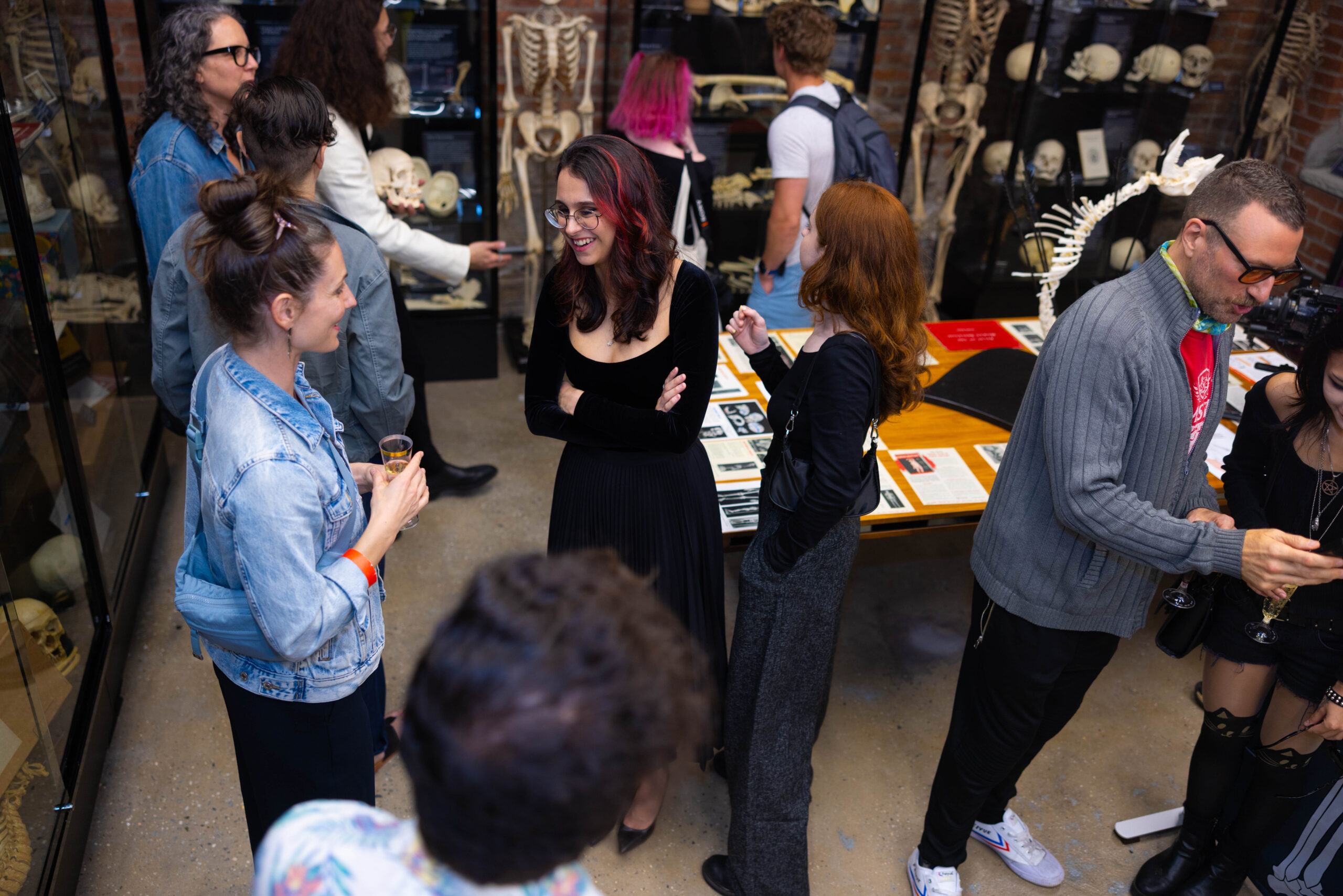Masha Potemkin in conversation with several visitors at The Bone Museum.