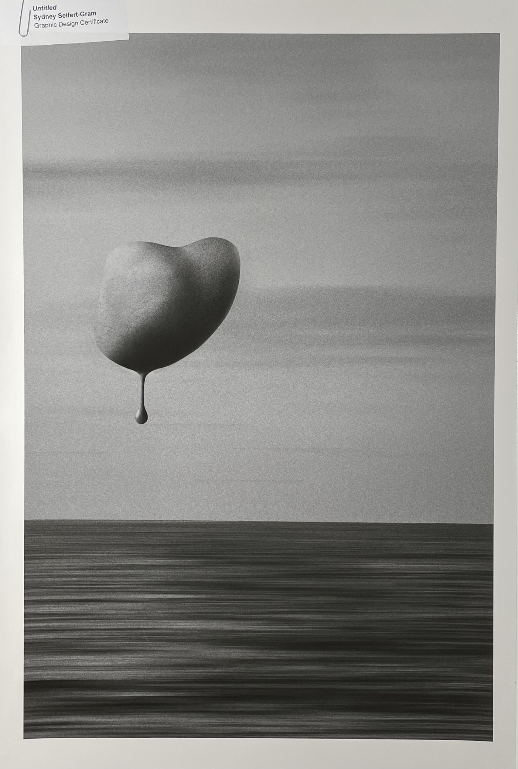 A monochromatic artwork featuring a large, heart-shaped object floating above a serene, textured sea. The background shows subtle gradients of gray, while the water appears in dark, horizontal strokes. Below the heart, a small droplet extends downward, adding a sense of motion. A label in the upper left corner identifies the piece as "Untitled" by Sydney Seifert-Gram.