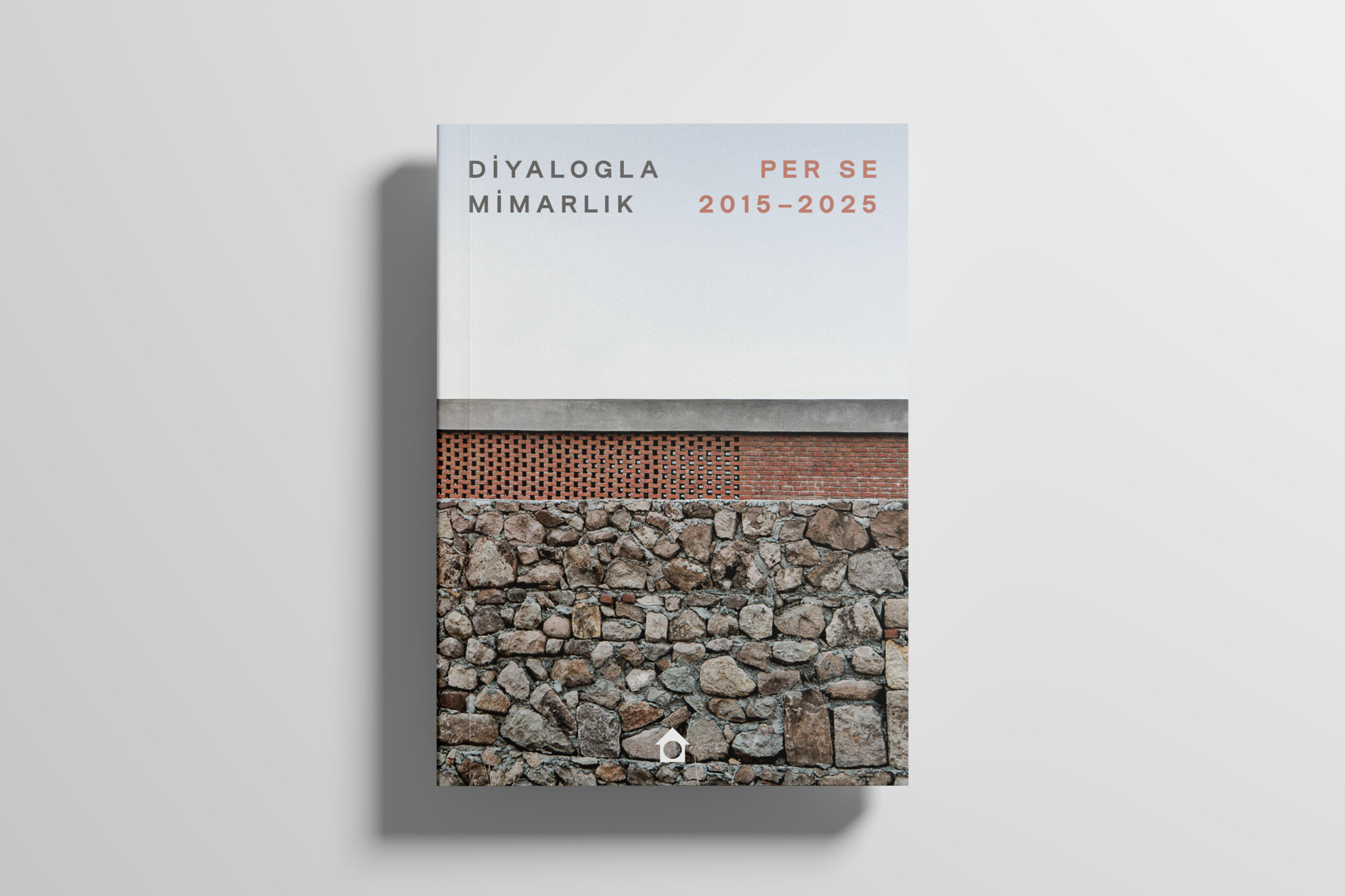 Book cover of Diyalogla Mimarklik (Architecture through Dialogue): Per Se 2015-2025. Cover features a photo of a stone wall, above which can be seen a brick wall and a concrete roof.