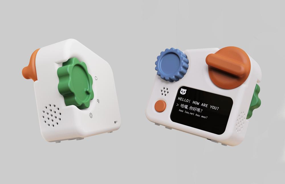 A playful, compact device resembling a toy, featuring colorful knobs and a small screen displaying text. The device has a white body with an orange knob, a blue gear-like dial, and a green flower-shaped button. Sounds can be emitted from a speaker located on one side. The screen shows a greeting in English and Chinese, inviting interaction.