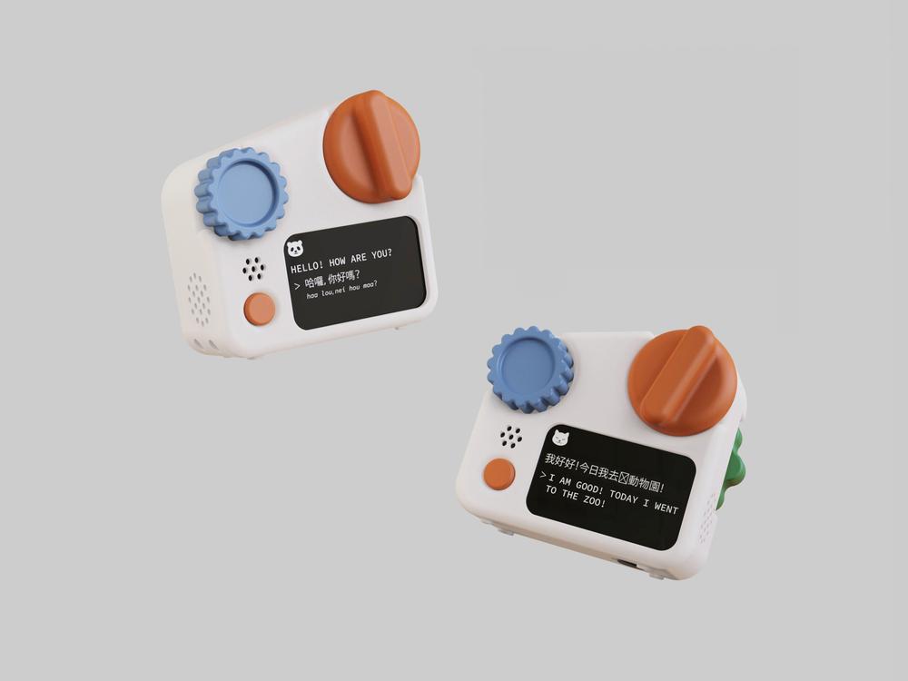 A small, stylized gadget resembling a camera or communication device is shown from two angles. The front features colorful dials in orange, blue, and green, a small screen displaying text, and a speaker grill. The opposite side has an additional green dial and minimal icons. The overall design is playful, with a white background emphasizing the device's colors and features.
