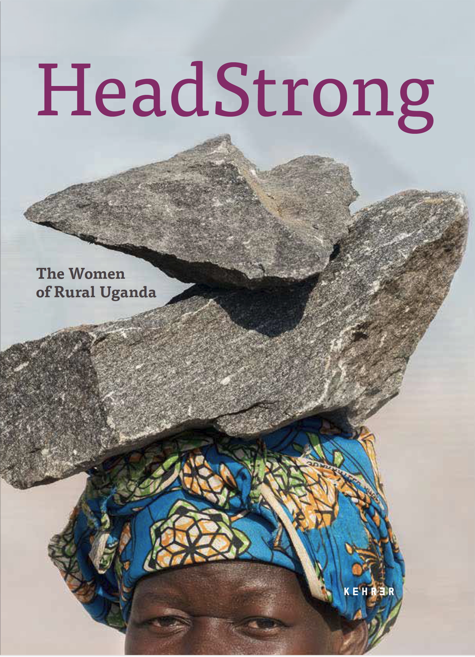 Book cover of HeadStrong: The Women of Rural Uganda features a portrait of a Ugandan woman balancing large stones on her head. She wears a teal headwrap decorated with a geometric pattern.