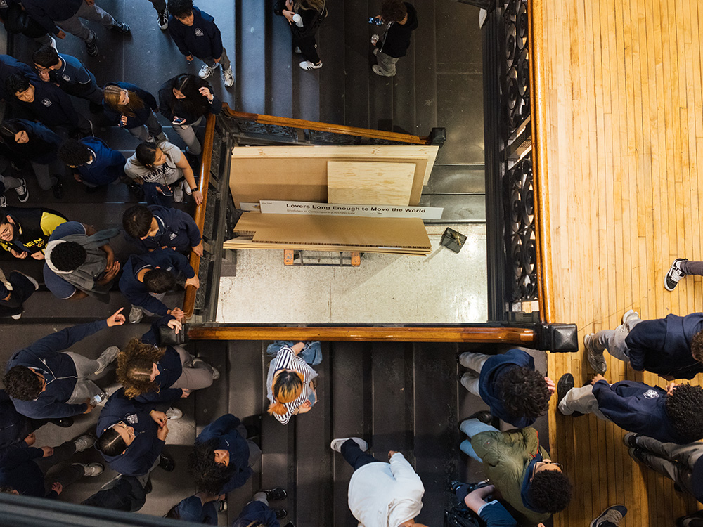 Aerial view of a staircase crowded with students.