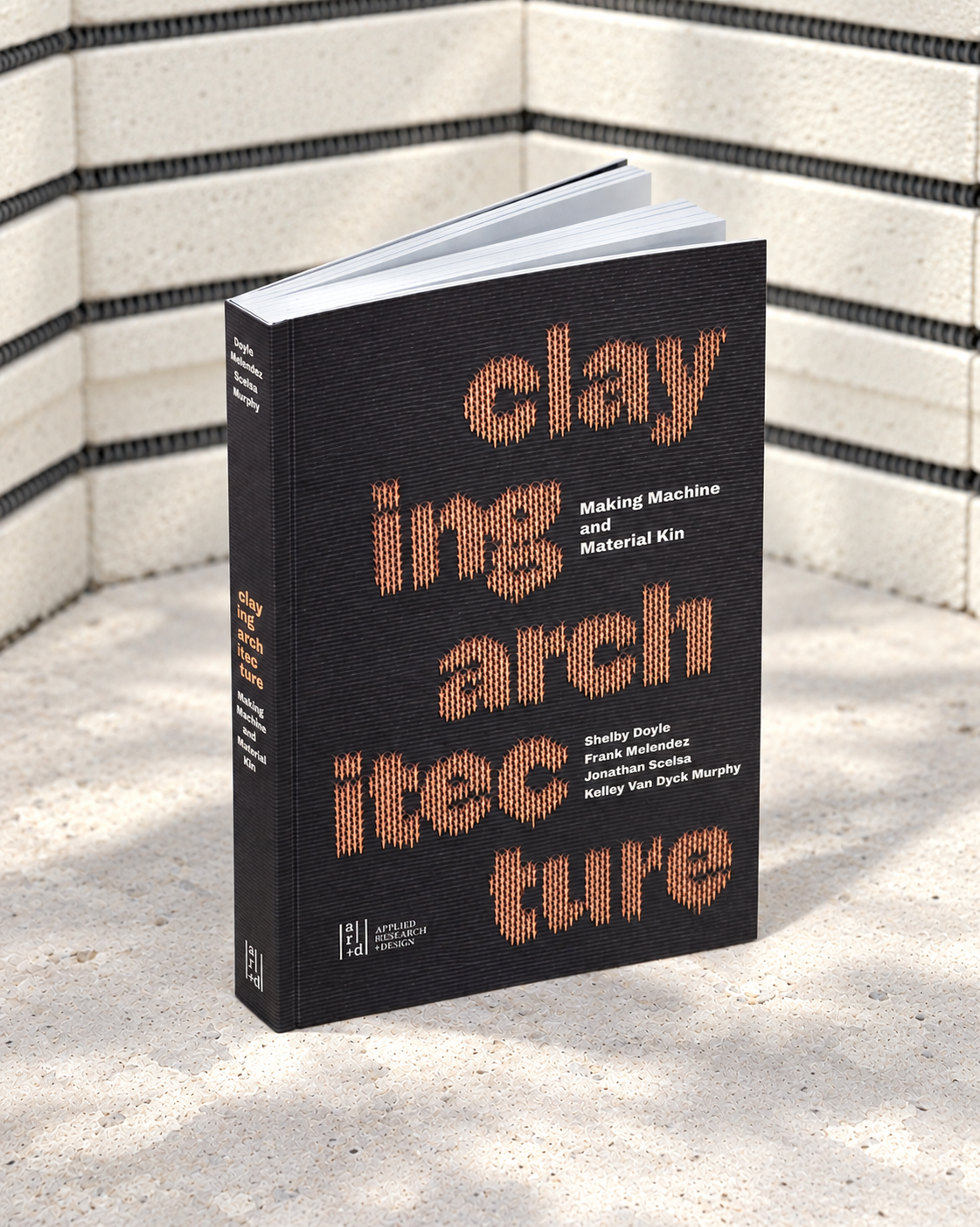 A black book with orange lettering with the book's title 