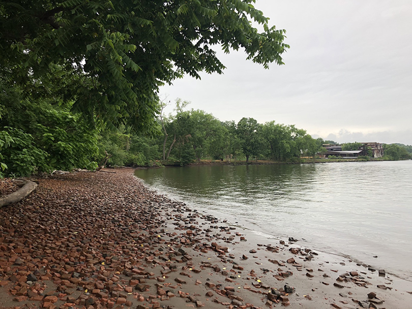 Bricks on the Hudson River shore of Kingston, New York, with the remains of Hutton Brick Works Company in the distance (courtesy Pratt Creative Xchange)