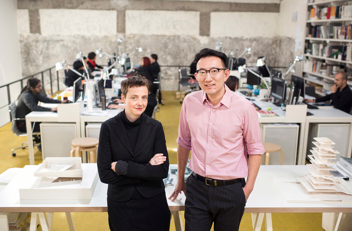Binke Lenhardt and Hao Dong standing together in their studio.