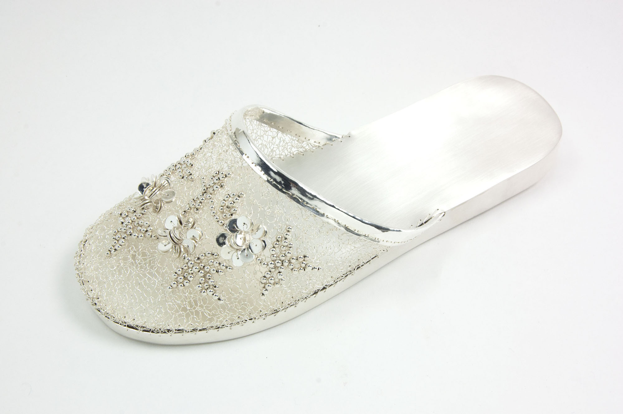 Ada Chen, “Chinese Slipper” (2017), fine silver with sterling silver beads, featured in Collective Ground at Steuben Gallery