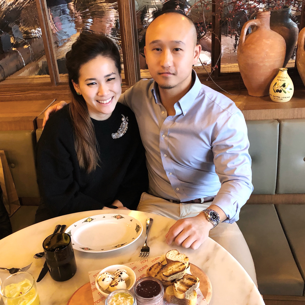 Janet Lee Chiang and Kenneth Chiang sitting together in a restaurant.