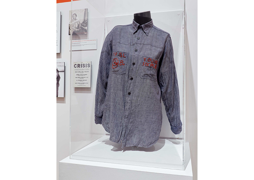 Installation view of Estelle M. Horowitz’s Young People’s Socialist League shirt in City of Workers, City of Struggle: How Labor Movements Changed New York