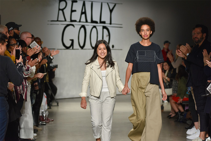 Graduating senior Elle Romero walks the runway with a model wearing one of her looks at Pratt Shows: Fashion | Really Good