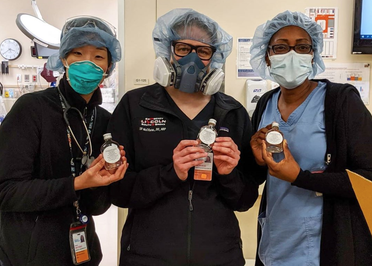 Frontline workers at Lincoln Hospital in the Bronx with hand sanitizer donated by Made in NYC member MÔTÔ Spirits