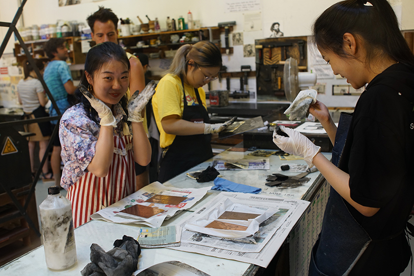 Printmaking students at work in the studio at the Scuola Internazionale di Grafica in Venice